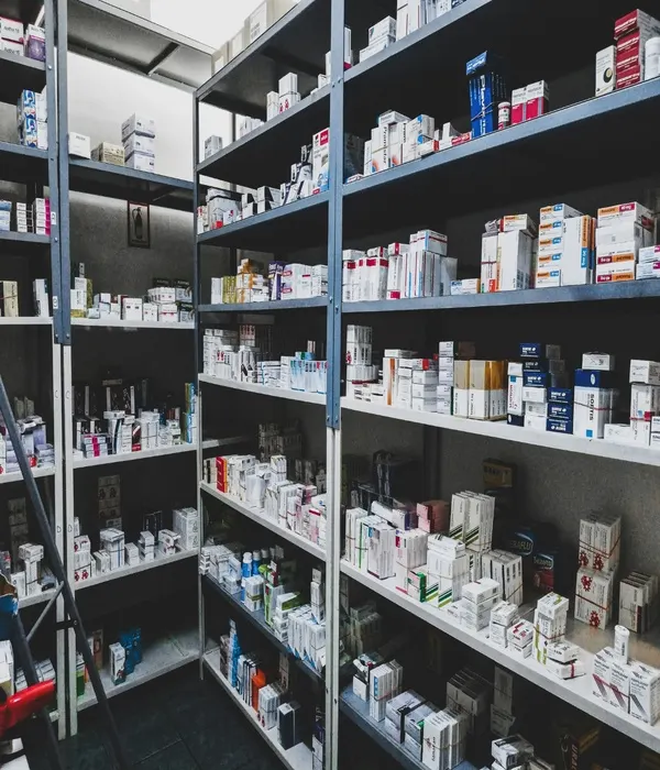 Pharmacy dispensary shelves stocked with medicines